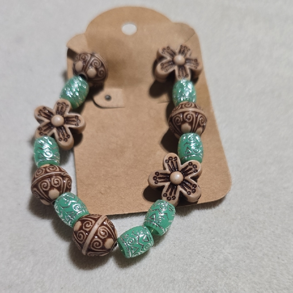 Brown and Green Beaded Bracelet with Intricate Patterns